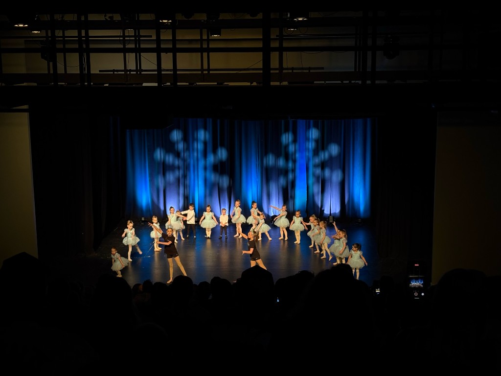 FLEX Dance Co recital - group performance on stage